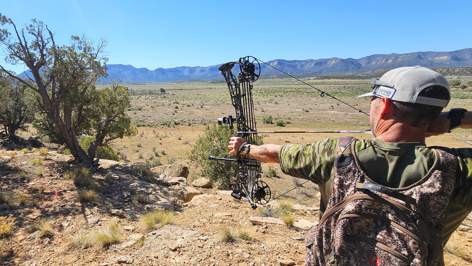 dark-timber-dolores-colorado-bow-services man shooting a dark timber bow in the desert near dolores colorado